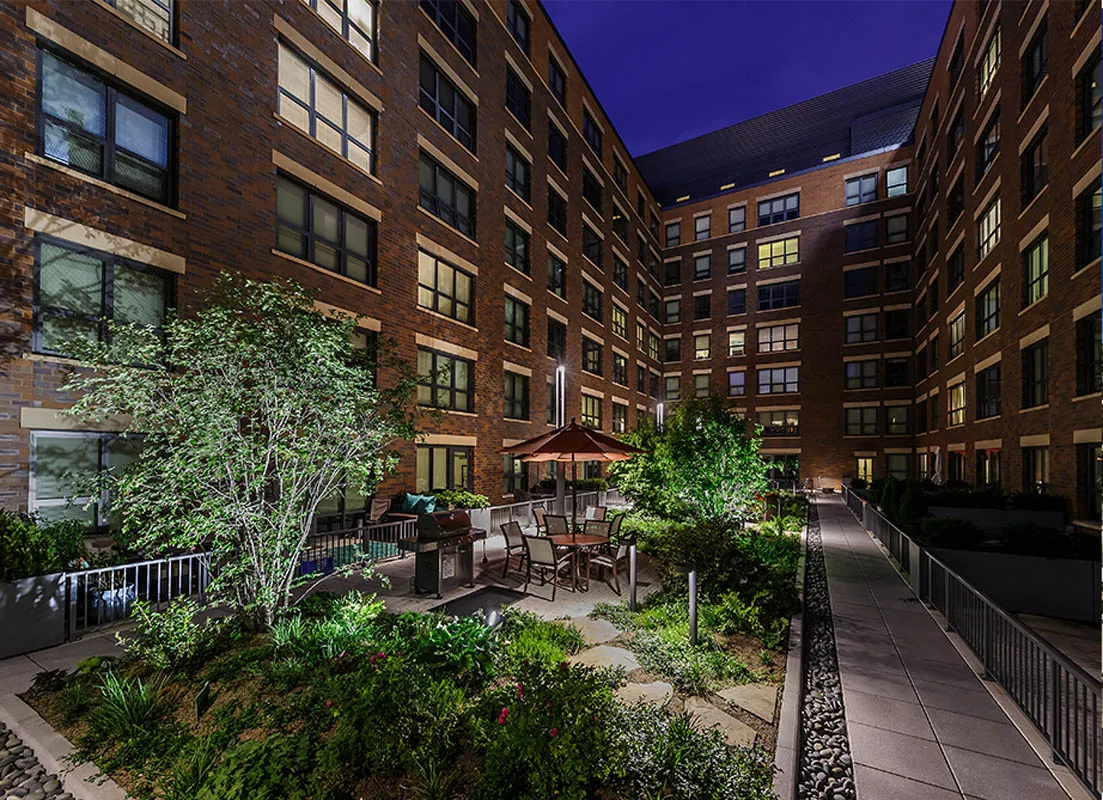 kitchen with view of living room at The Madison at Racine Apartments