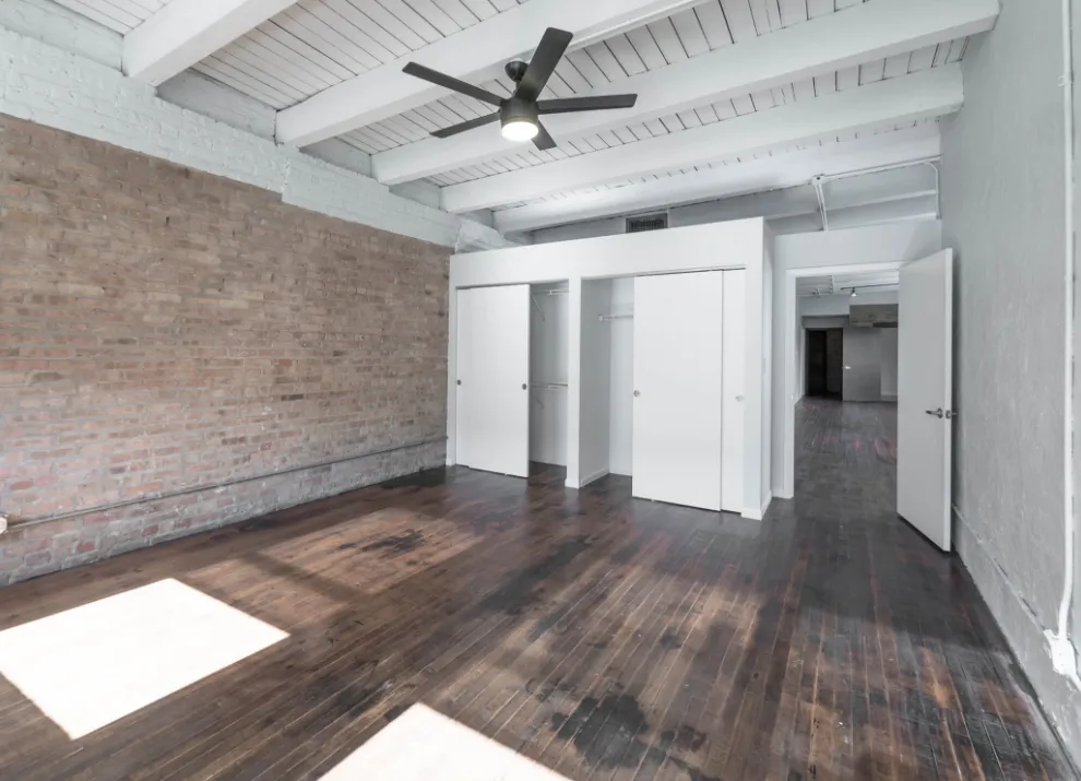 model kitchen with timber ceiling and brick wall- 1012 West Randolph Lofts