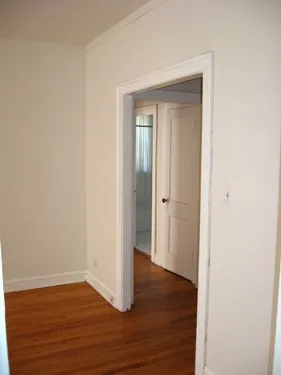 model kitchen with wood floors at 822-836 South Austin Apartments