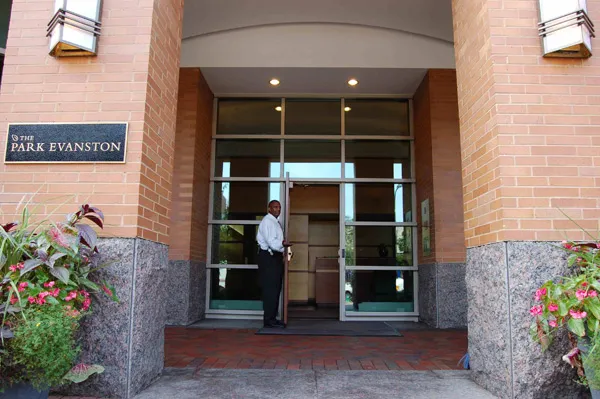 flowers surround the entrance of The Park Evanston Apartments in Evanston