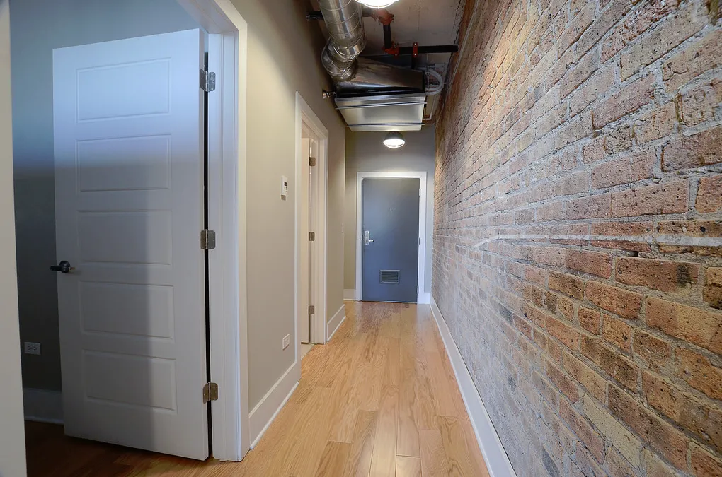 exposed brick in living room of 3141 North Sheffield Apartments in Lakeview