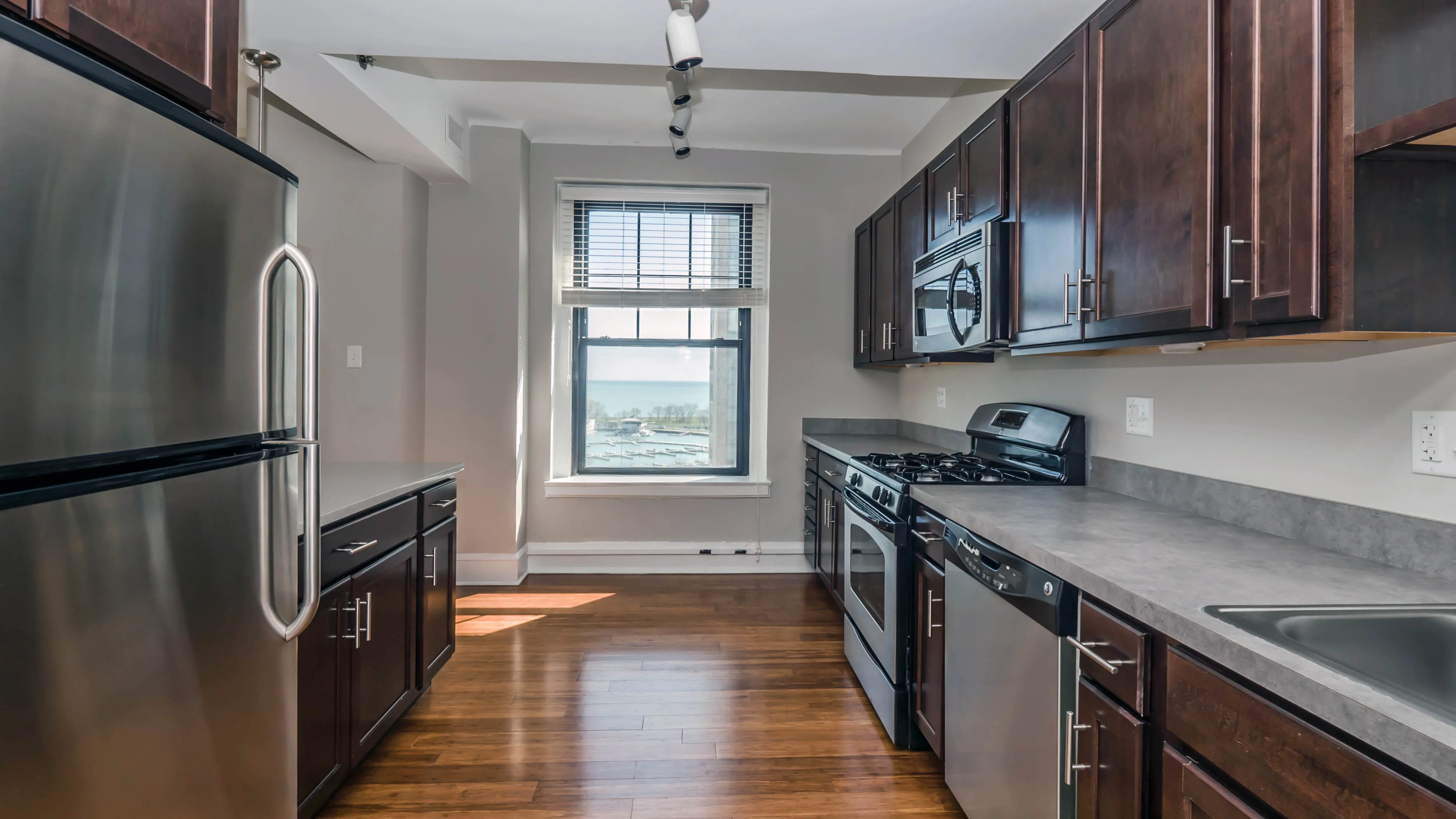 lobby entrance with limestone facade at The Belmont By Reside Apartments