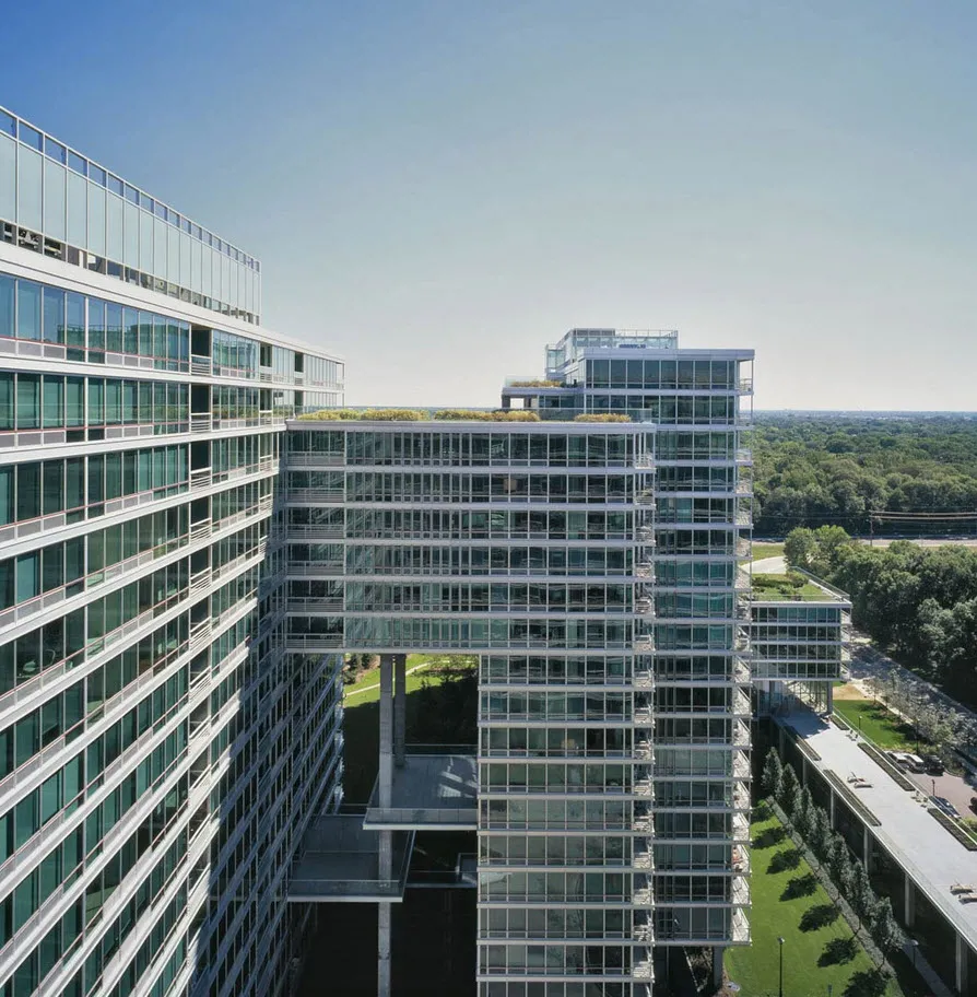 rendering look up at the architecture of Optima Old Orchard Woods Apartment