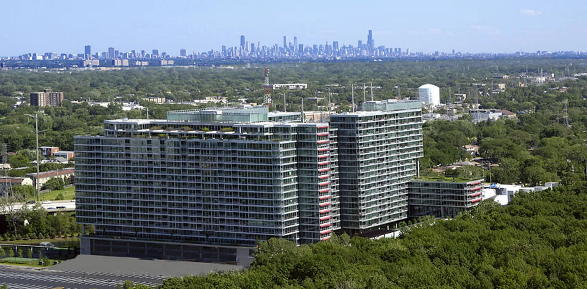 rendering look up at the architecture of Optima Old Orchard Woods Apartment