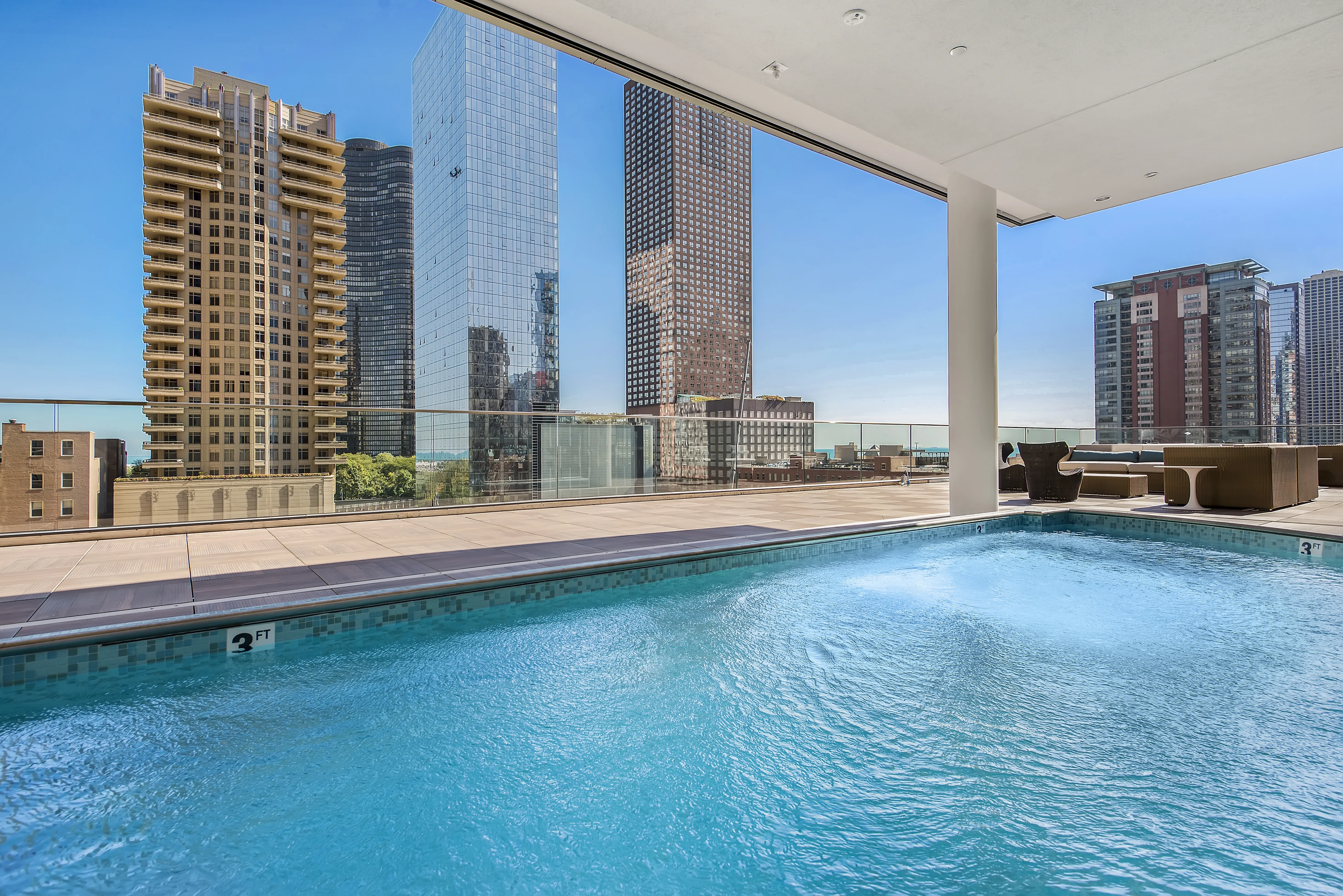 living room with brown couch at Moment Apartments in Streeterville Chicago