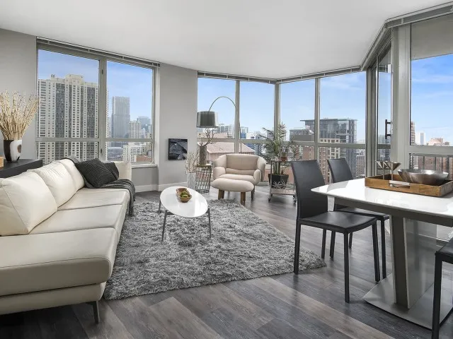 furnished model living room at One East Delaware Apartments