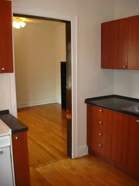 model kitchen with wood floors at 822-836 South Austin Apartments