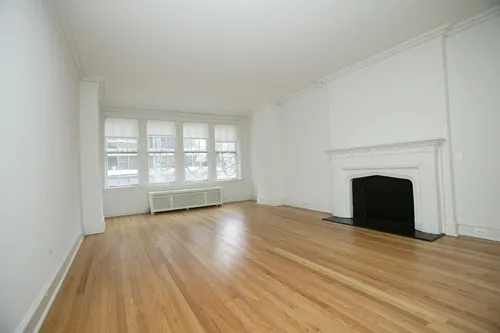 enormous living room with wood floors at 3000 N Sheridan Apartments