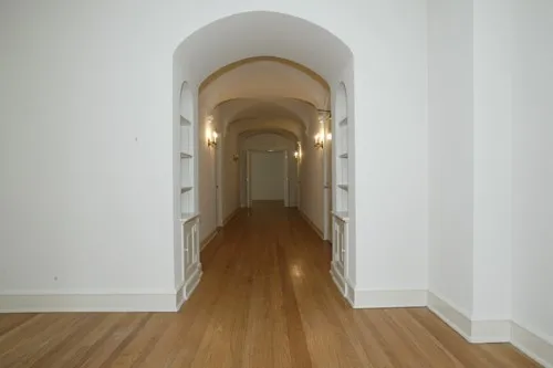 enormous living room with wood floors at 3000 N Sheridan Apartments