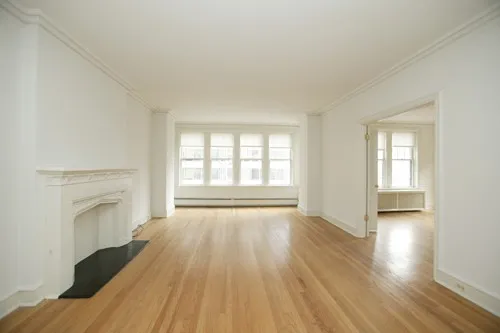 enormous living room with wood floors at 3000 N Sheridan Apartments