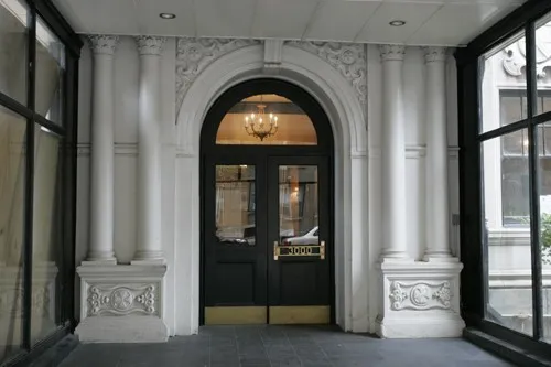 enormous living room with wood floors at 3000 N Sheridan Apartments