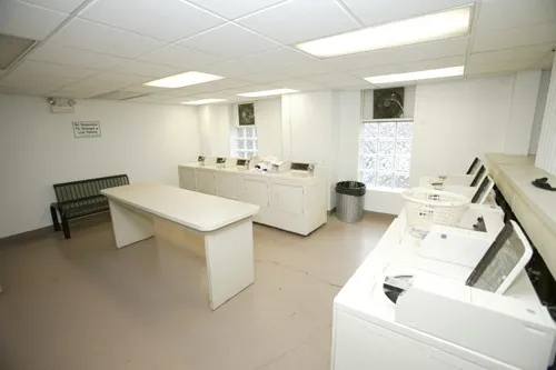 enormous living room with wood floors at 3000 N Sheridan Apartments