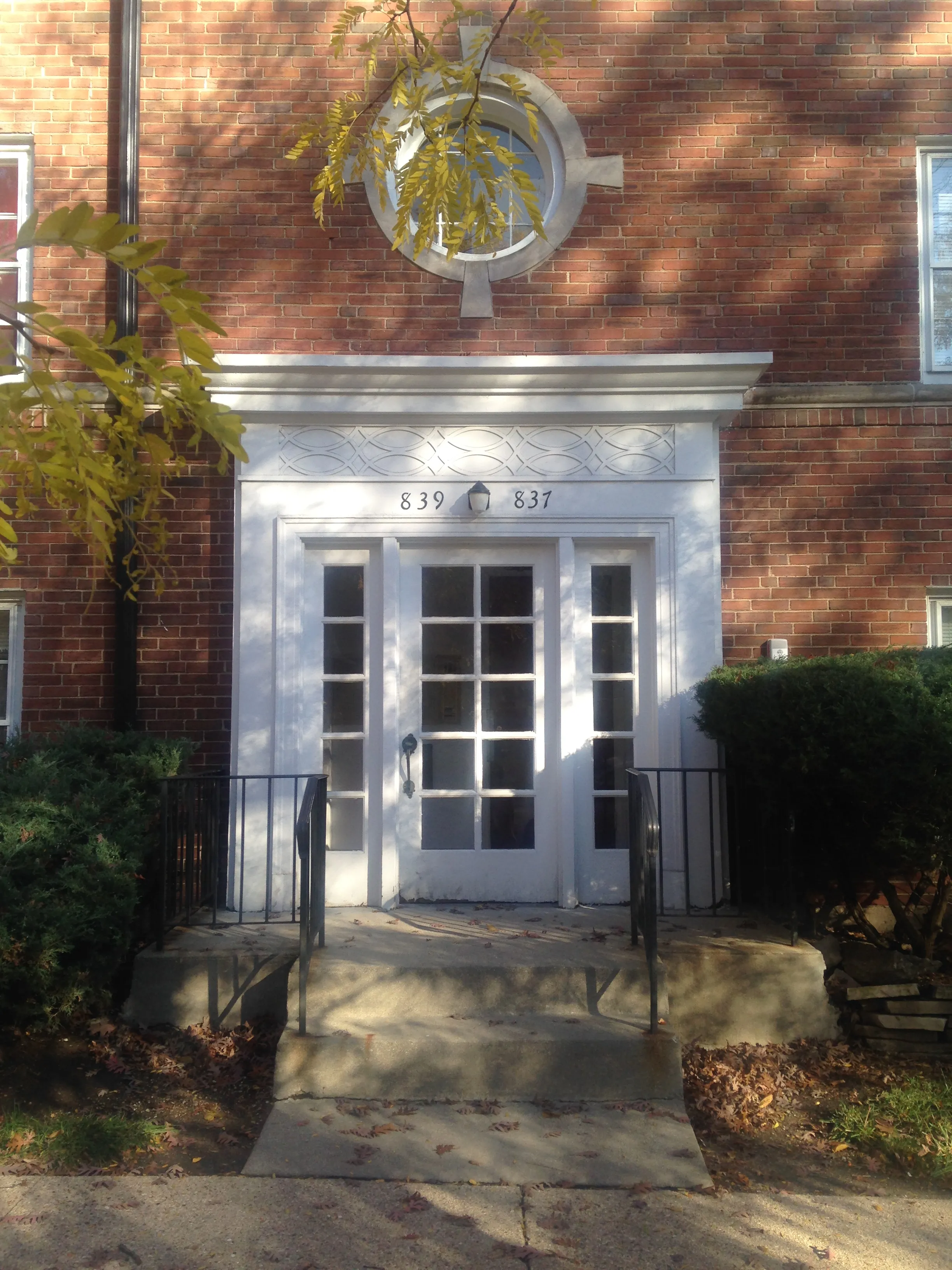 outside the colonial style 303 Ridge Apartments