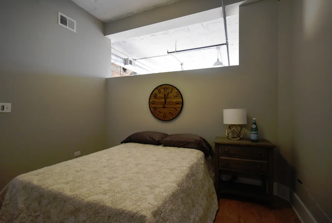 exposed brick in living room of 3141 North Sheffield Apartments in Lakeview