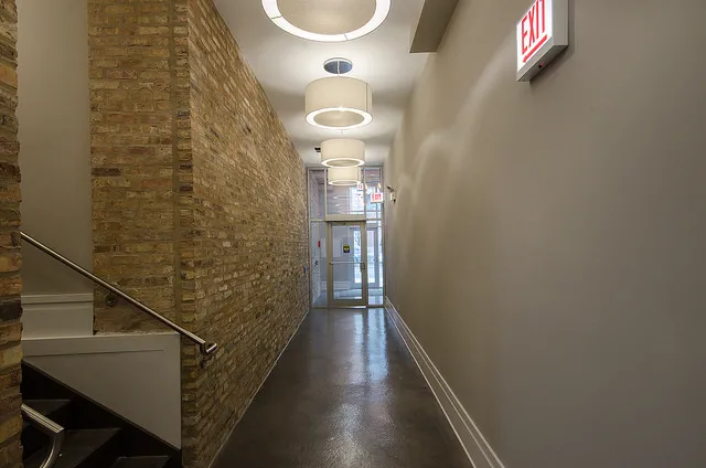 exposed brick in living room of 3141 North Sheffield Apartments in Lakeview