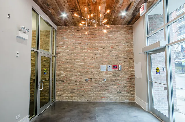 exposed brick in living room of 3141 North Sheffield Apartments in Lakeview
