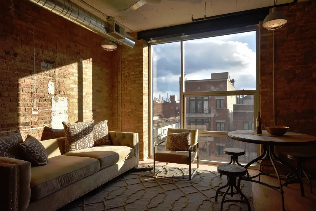 exposed brick in living room of 3141 North Sheffield Apartments in Lakeview