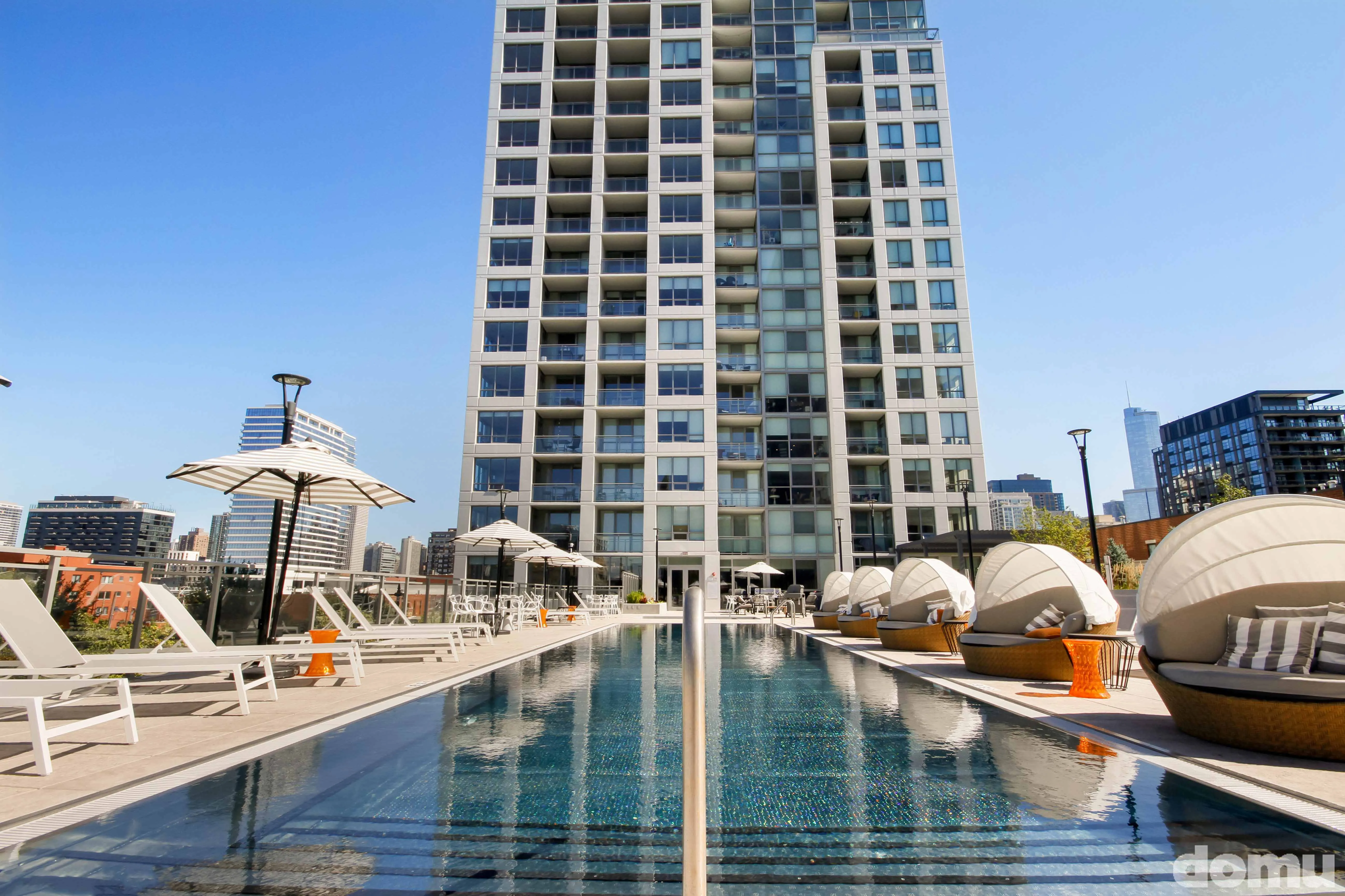 outdoor pool and exterior view at The Hudson Apartments in Chicago