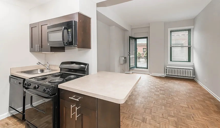 street entrance of Reside on Wellington Apartments in Lakeview Chicago