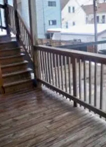 the grass and landscaped courtyard of The Dickens Courtyard Apartments