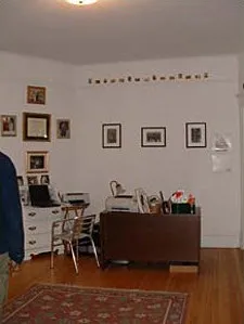 graystone facade of three story 450 W St James Place Apartments