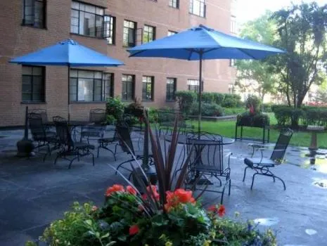 exterior view of trees and the two towers of 5630 North Sheridan Apartments