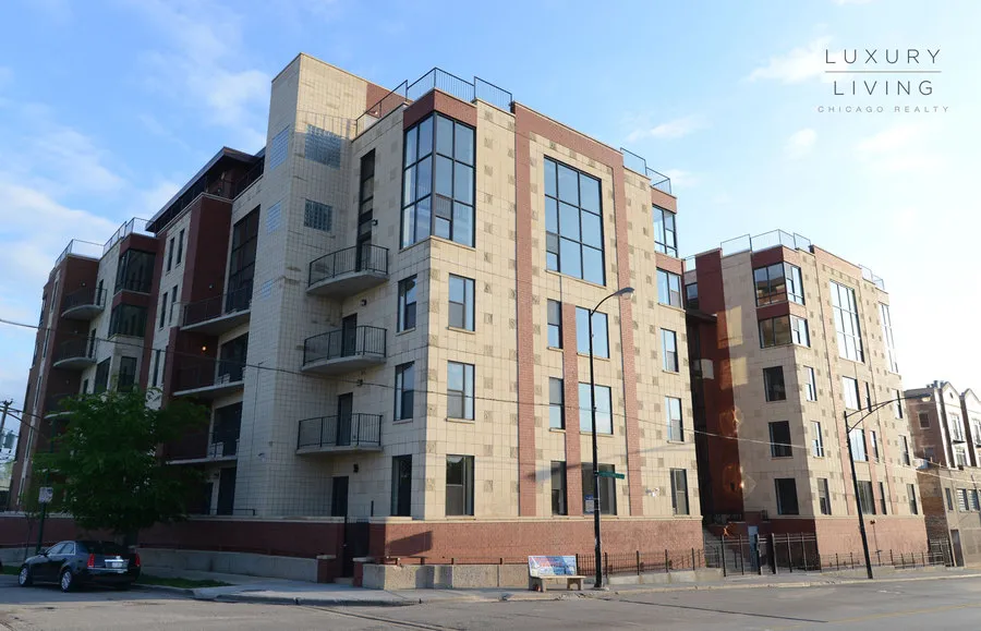kitchen and island with wood floors at Riverview Terrace Apartments