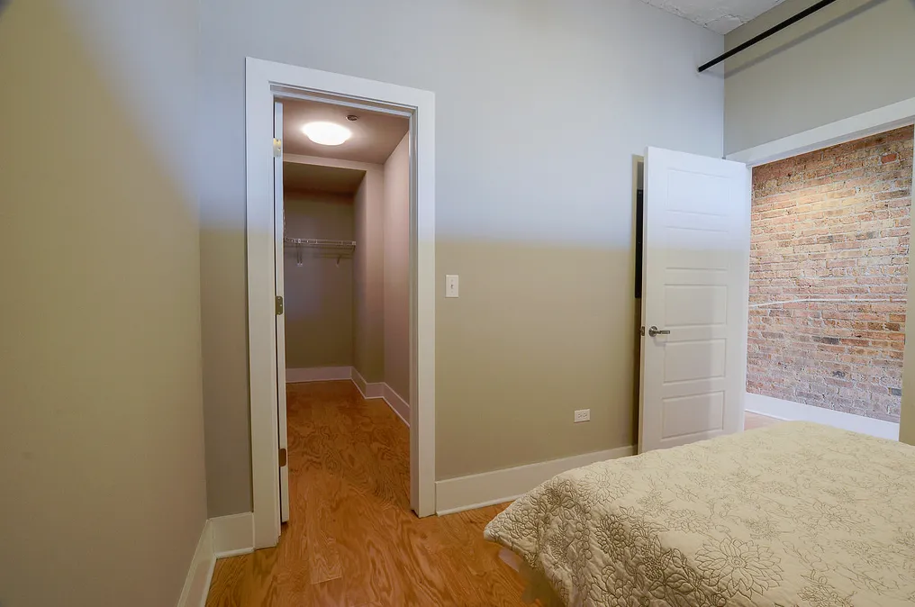 exposed brick in living room of 3141 North Sheffield Apartments in Lakeview