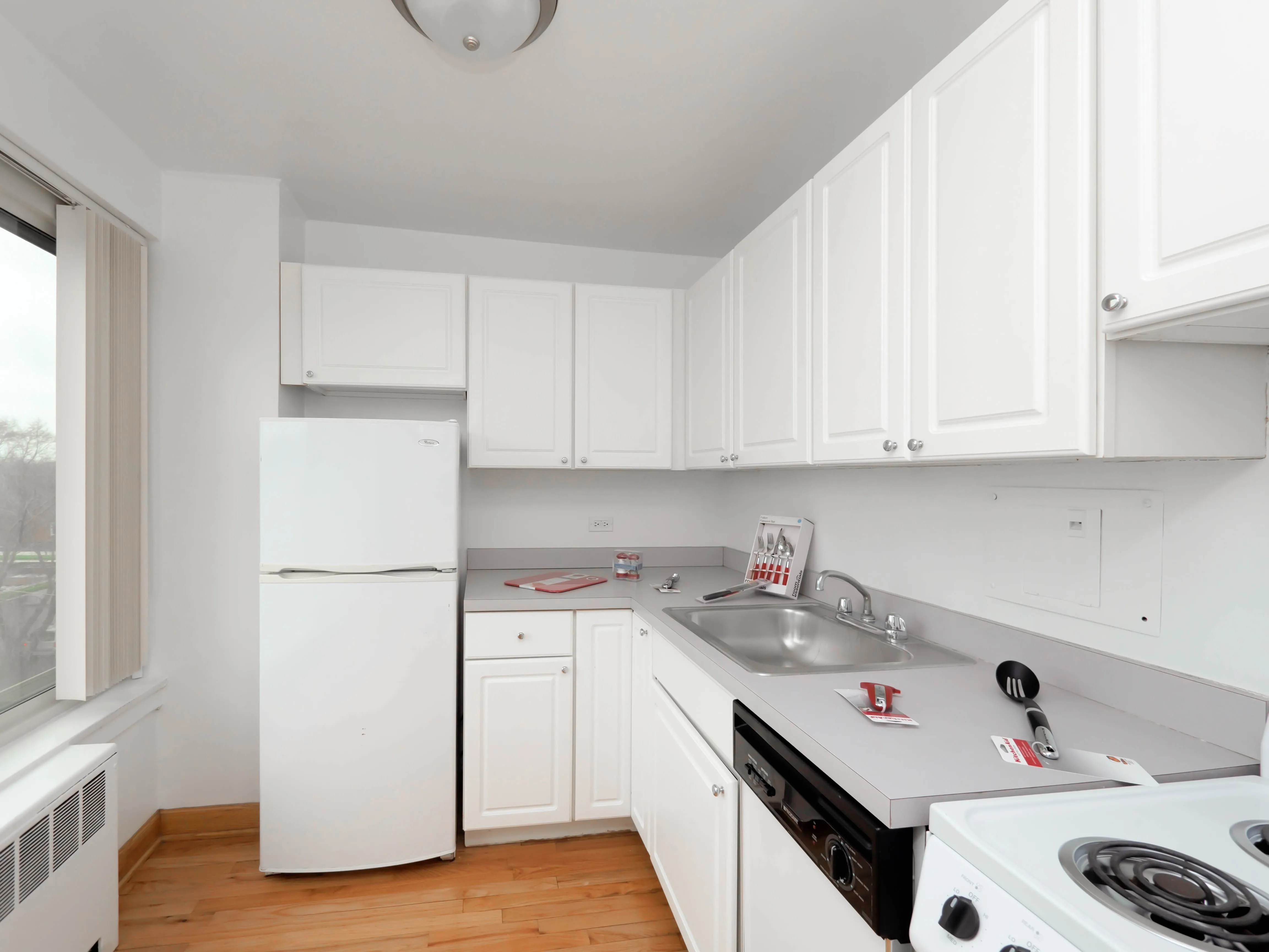 wood floors in living room at Clarendon Shores Apartments in Uptown