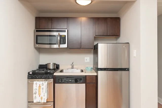 living room and kitchen view at 2244 N. Cleveland Apartments in Chicago
