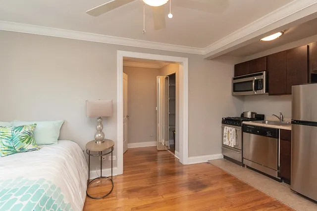 living room and kitchen view at 2244 N. Cleveland Apartments in Chicago