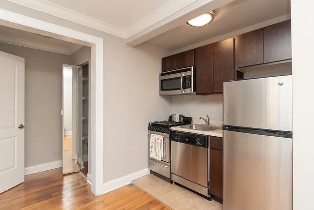 living room and kitchen view at 2244 N. Cleveland Apartments in Chicago