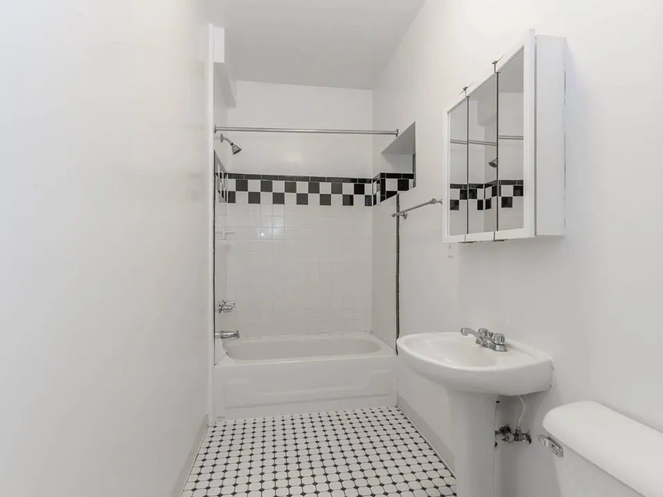 Bathroom with tile at Ashland Manor Apartments in Ravenswood Chicago