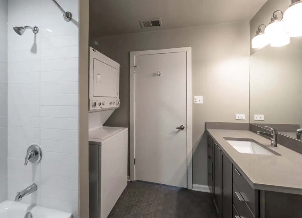 model kitchen with timber ceiling and brick wall- 1012 West Randolph Lofts