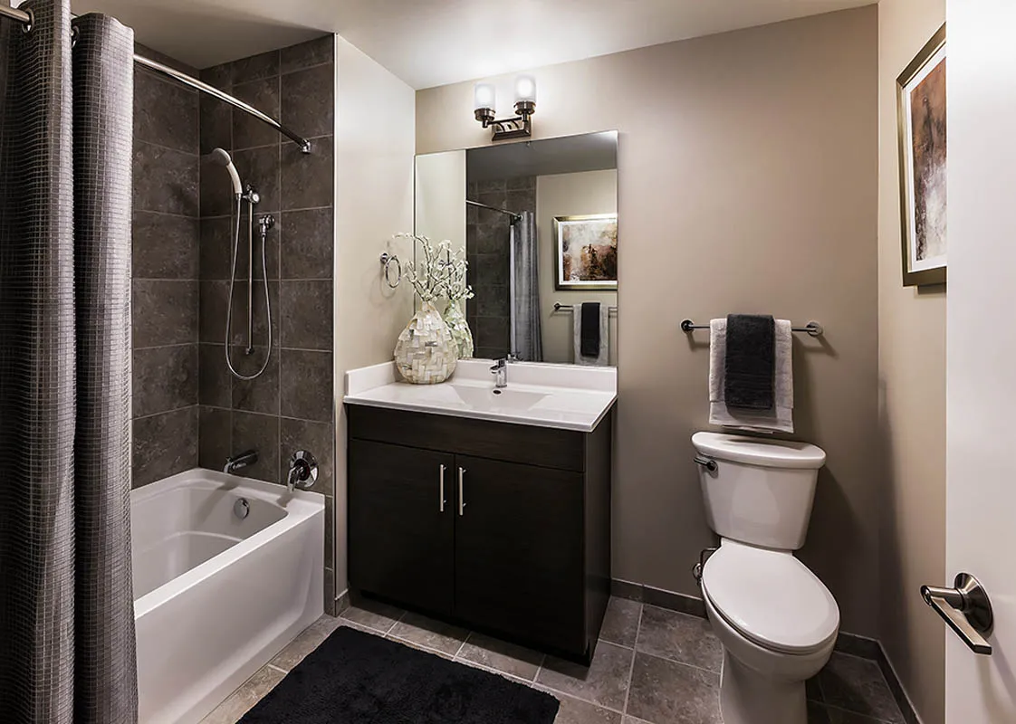 kitchen with view of living room at The Madison at Racine Apartments