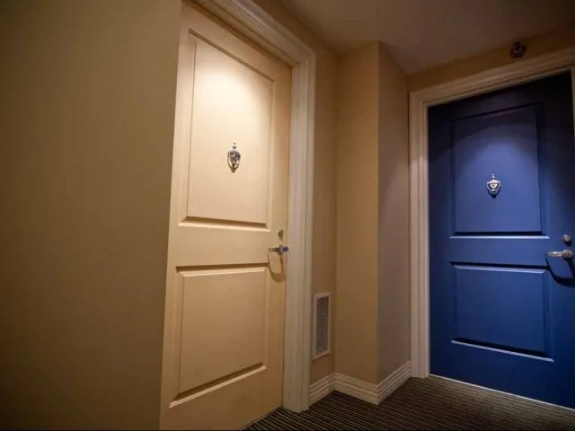 view looking up at The Bernardin Apartments with car traffic