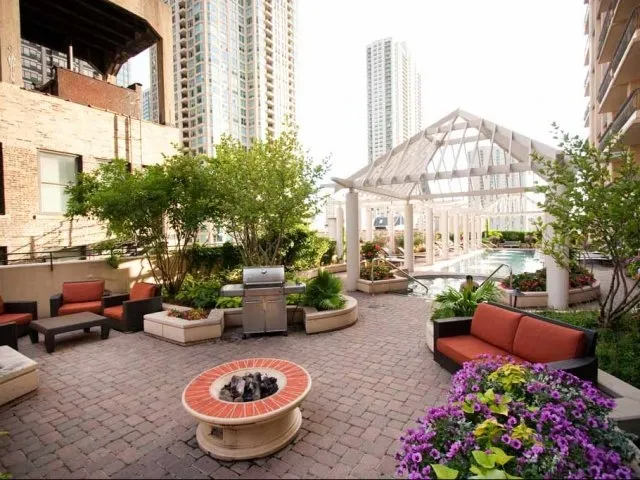 view looking up at The Bernardin Apartments with car traffic