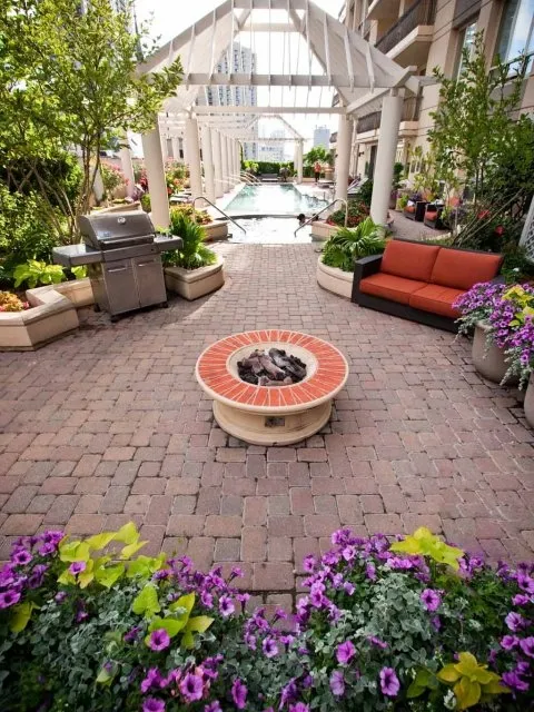 view looking up at The Bernardin Apartments with car traffic