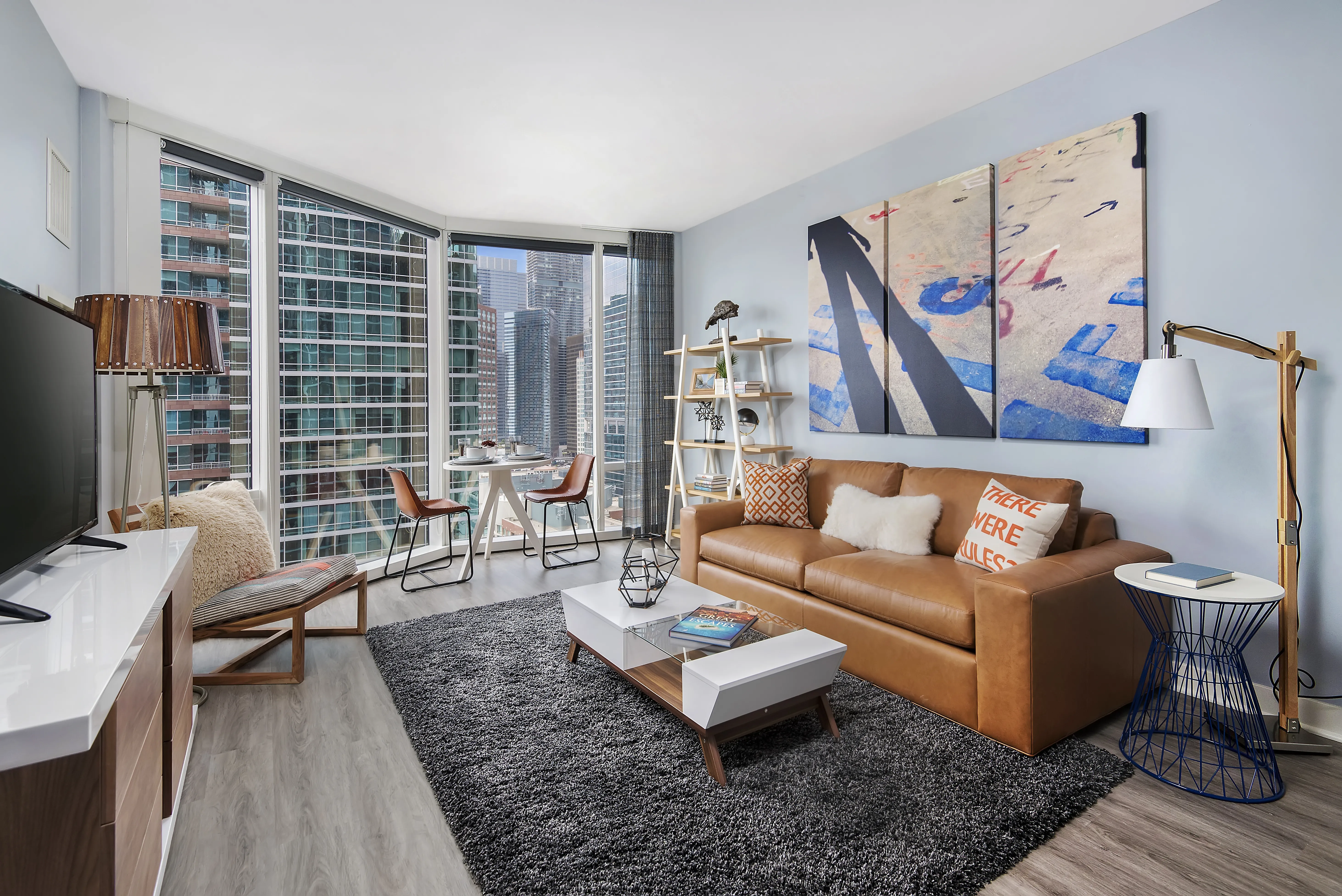 living room with brown couch at Moment Apartments in Streeterville Chicago