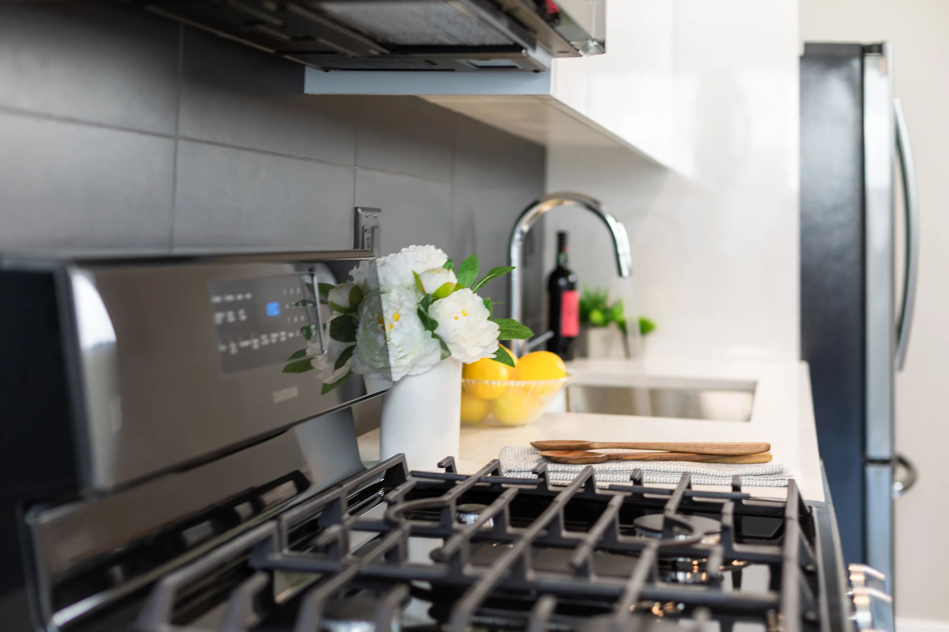 model apartment kitechen with wood floors at Clarkview Apartments