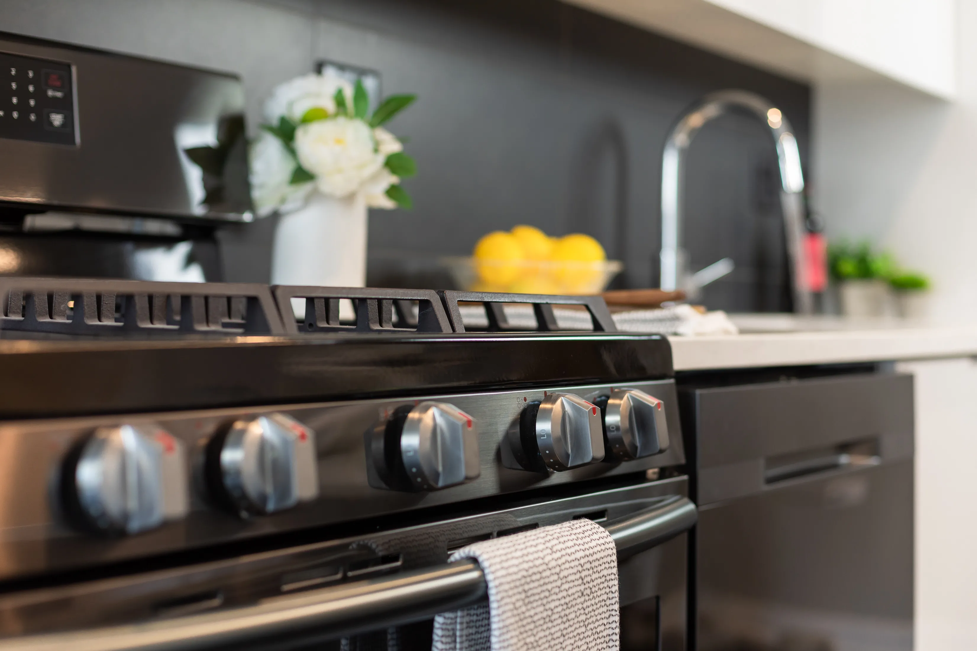 model apartment kitechen with wood floors at Clarkview Apartments