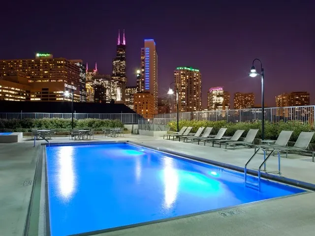 outdoor pool at night at Kingsbury Plaza Apartments in River North Chicago