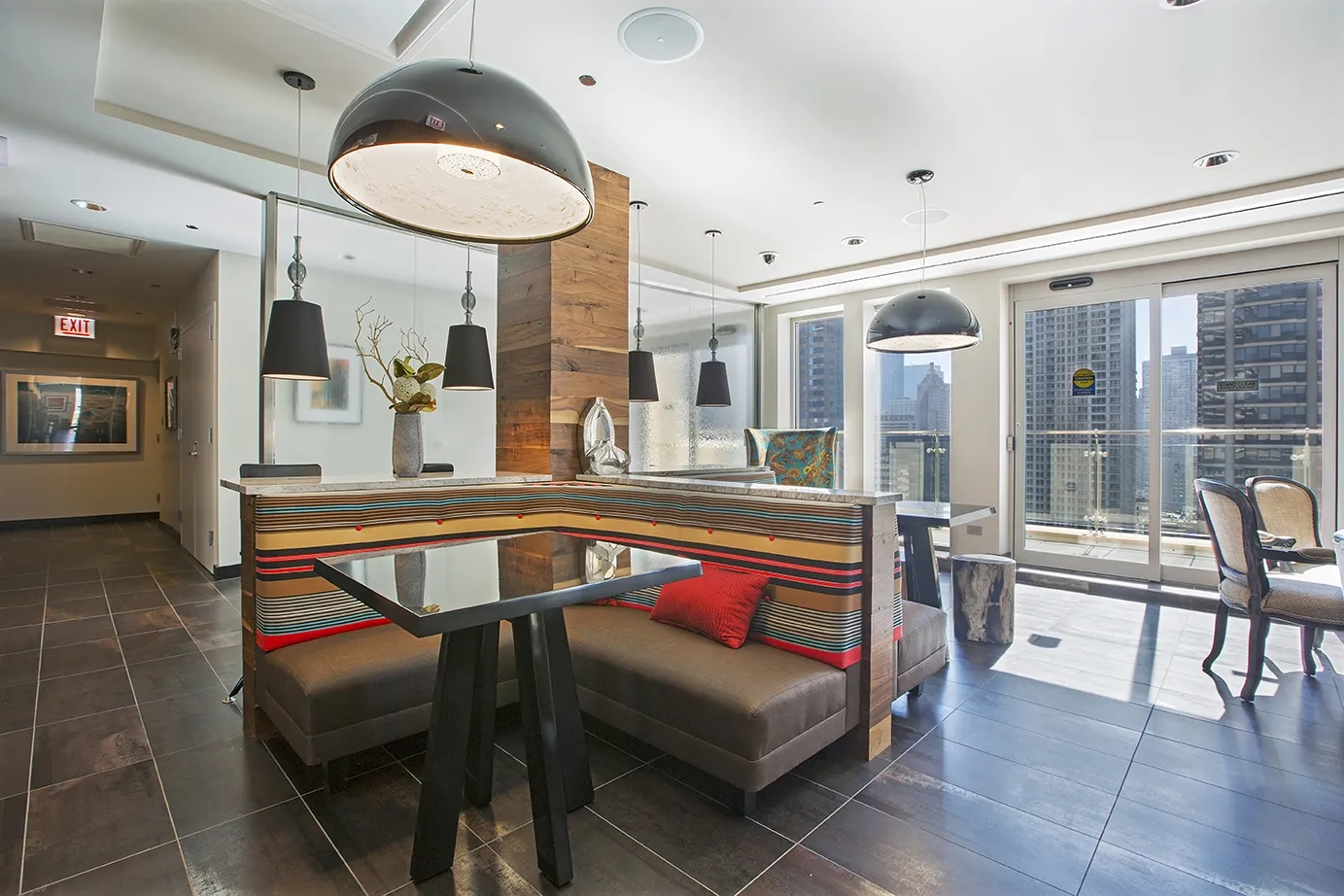 view looking up at The Bernardin Apartments with car traffic