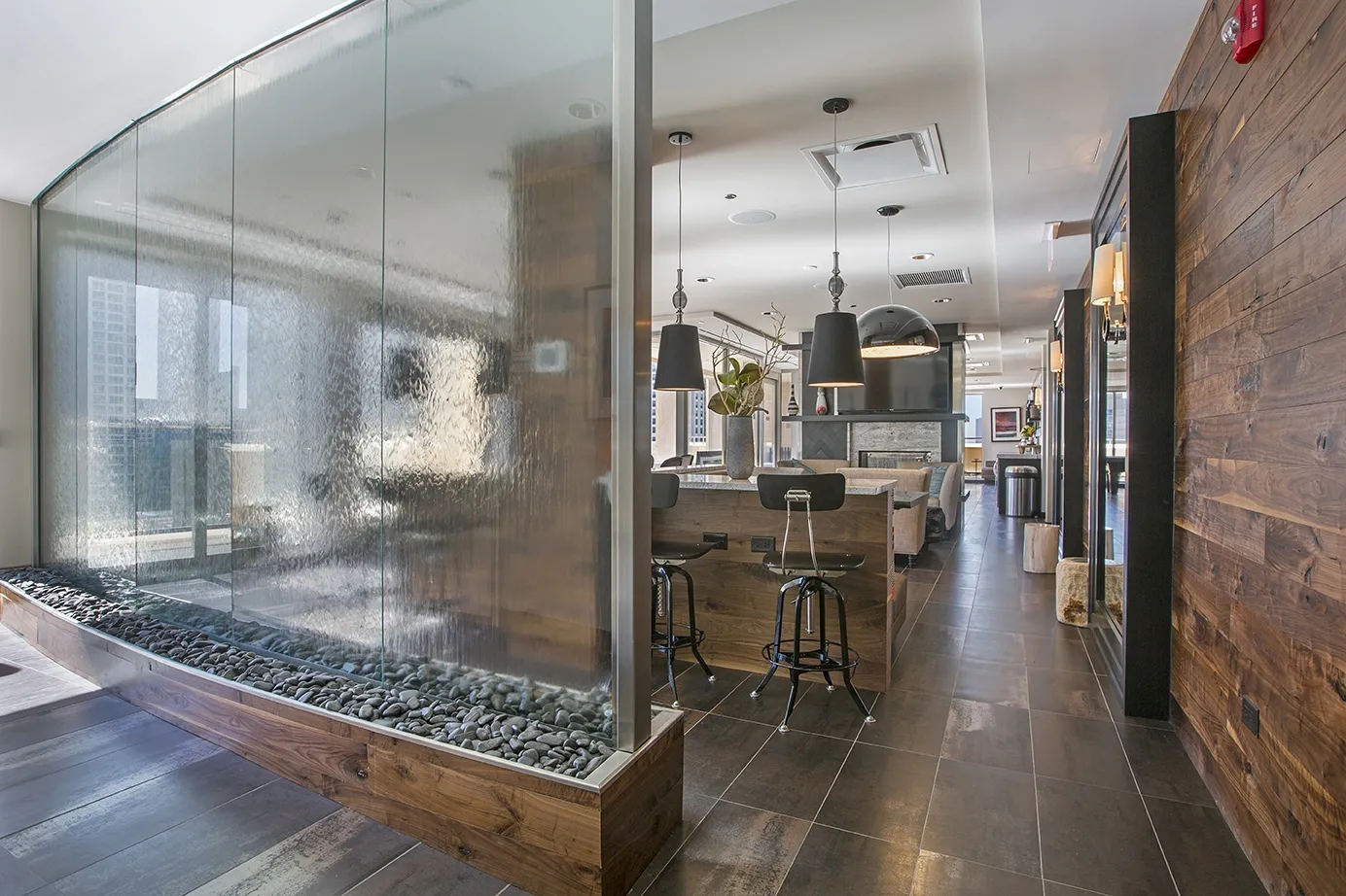 view looking up at The Bernardin Apartments with car traffic