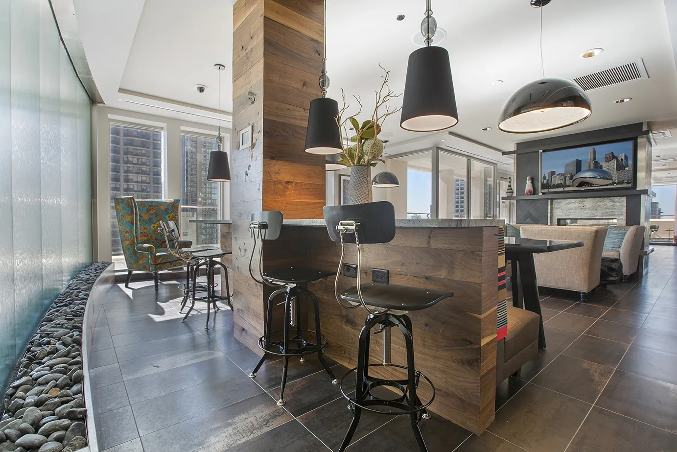 view looking up at The Bernardin Apartments with car traffic