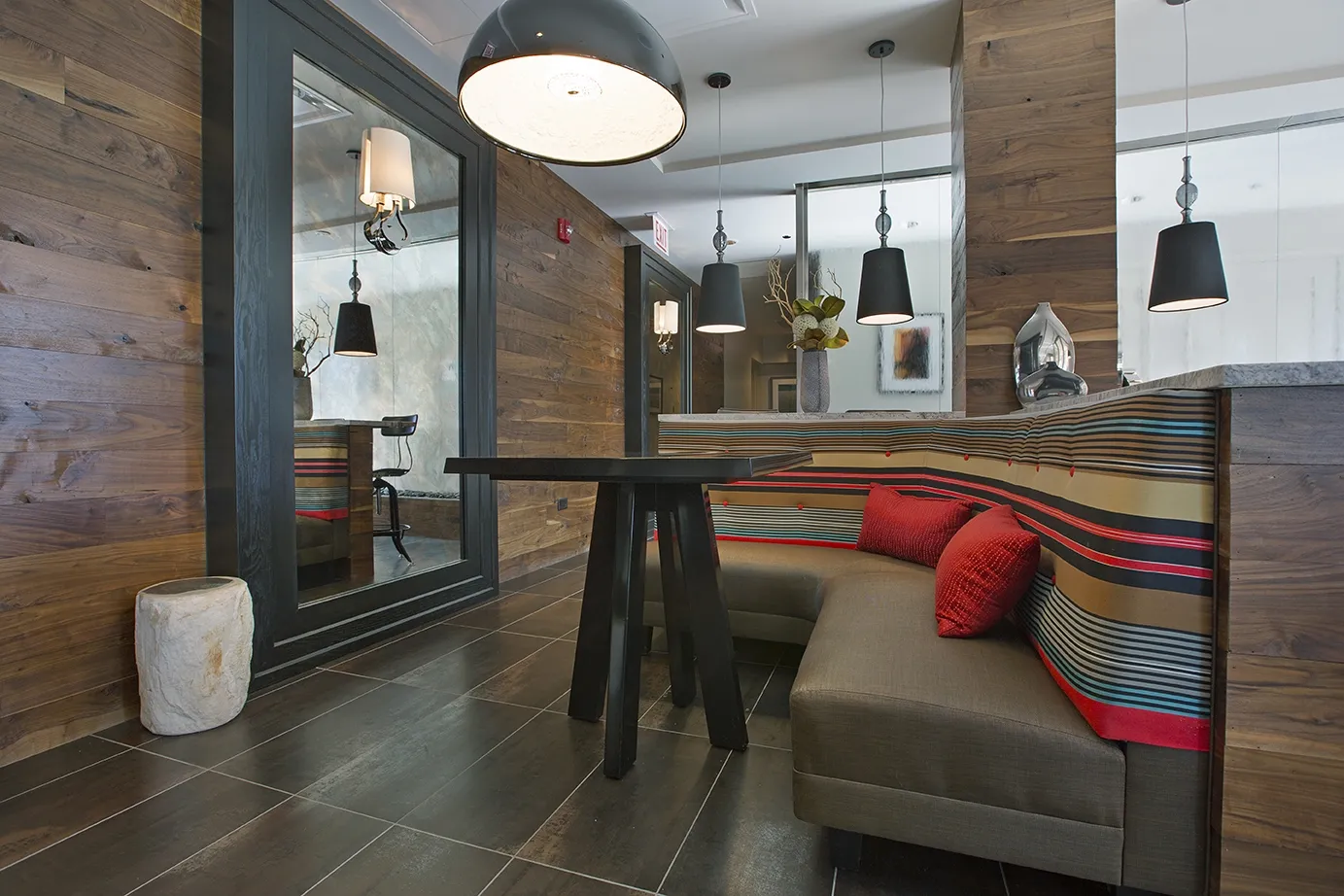 view looking up at The Bernardin Apartments with car traffic