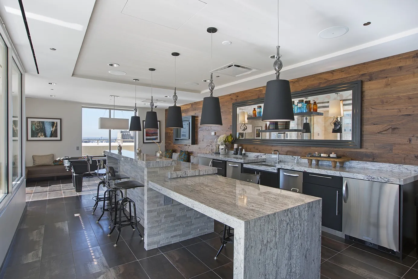 view looking up at The Bernardin Apartments with car traffic