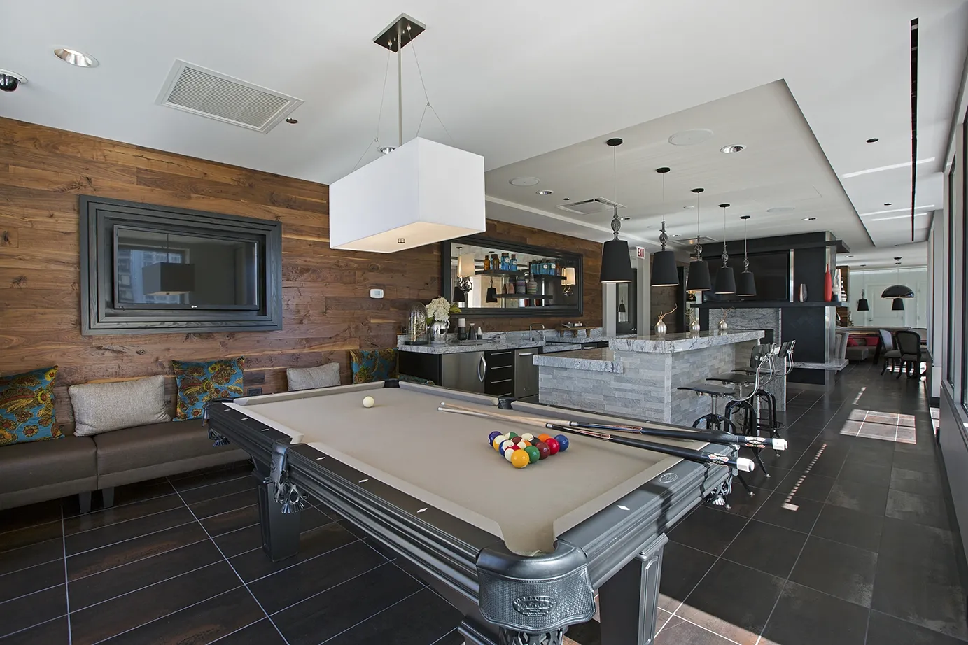 view looking up at The Bernardin Apartments with car traffic