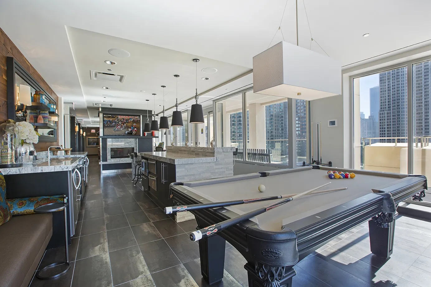 view looking up at The Bernardin Apartments with car traffic