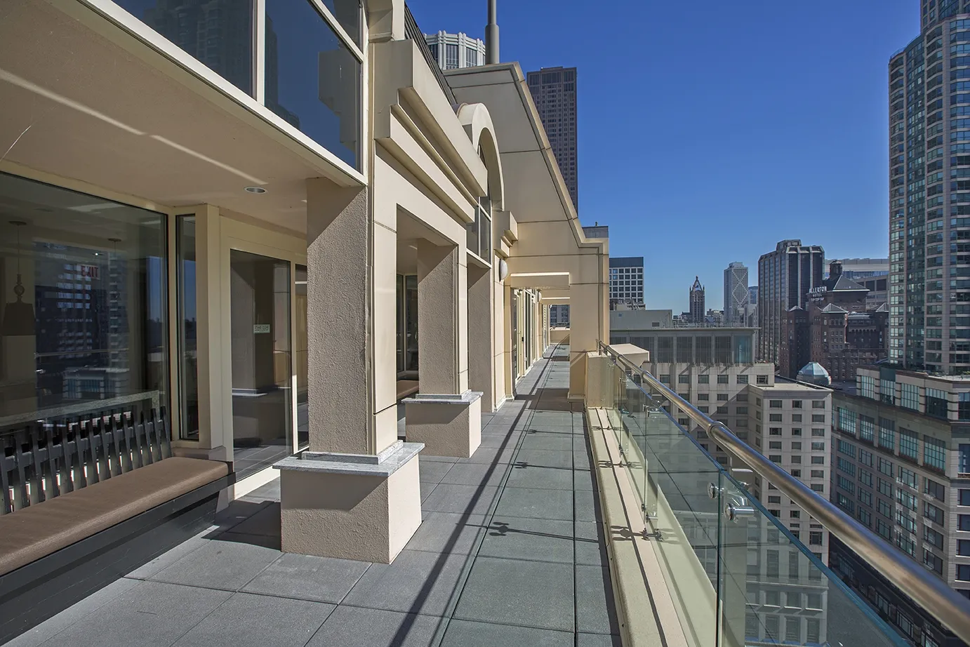 view looking up at The Bernardin Apartments with car traffic